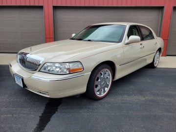 235/55R17 White/Red tires on a 2003 LINCOLN TOWN CAR