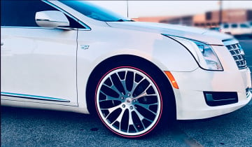 Vogue 245/40R20 White/Red tires on a 2013 CADILLAC XTS