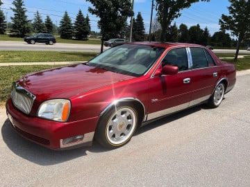 225/60R16 White/Gold tires on a 2005 CADILLAC DE VILLE