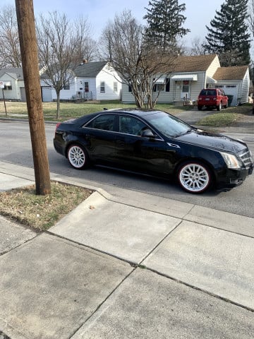 Vogue 235/55R17 White/Red tires on a 2011 CADILLAC CTS SEDAN