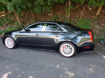 Vogue 235/55R17 White/Red tires on a 2011 CADILLAC CTS SEDAN
