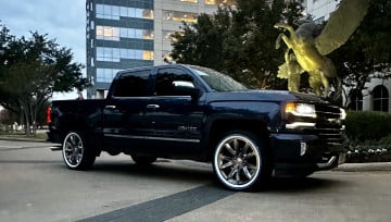 Vogue 285/45R22 White/Blue tires on a 2023 CHEVROLET SILVERADO 1500 LT