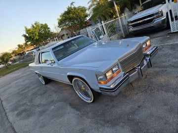 265/35R22 White/Gold tires on a 1982 Cadillac Coupe Deville