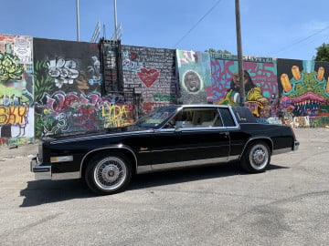 Vogue 235/70R15 White/Gold tires on a 1985 Cadillac Elderado