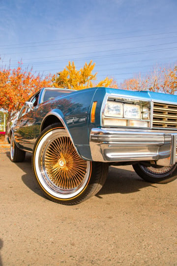 Vogue 285/45R22 White/Gold tires on a 1977 Chevrolet Impala
