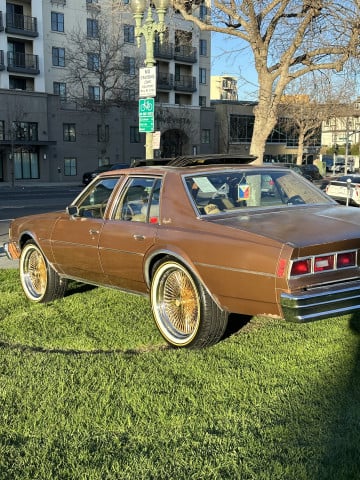 Vogue 285/45R22 White/Gold tires on a 1979 Chevrolet Impala