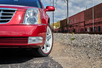 Vogue 235/55R17 White/Red tires on a 2009 CADILLAC DTS
