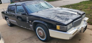 215/70R15 White/Blue tires on a 1990 Cadillac Sedan DeVille