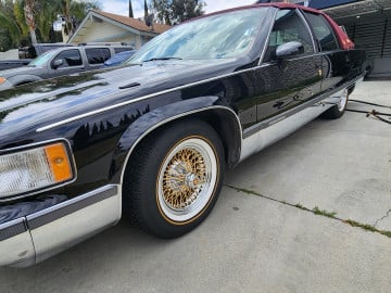 Vogue 215/70R15 White/Gold tires on a 1994 Cadillac Brougham