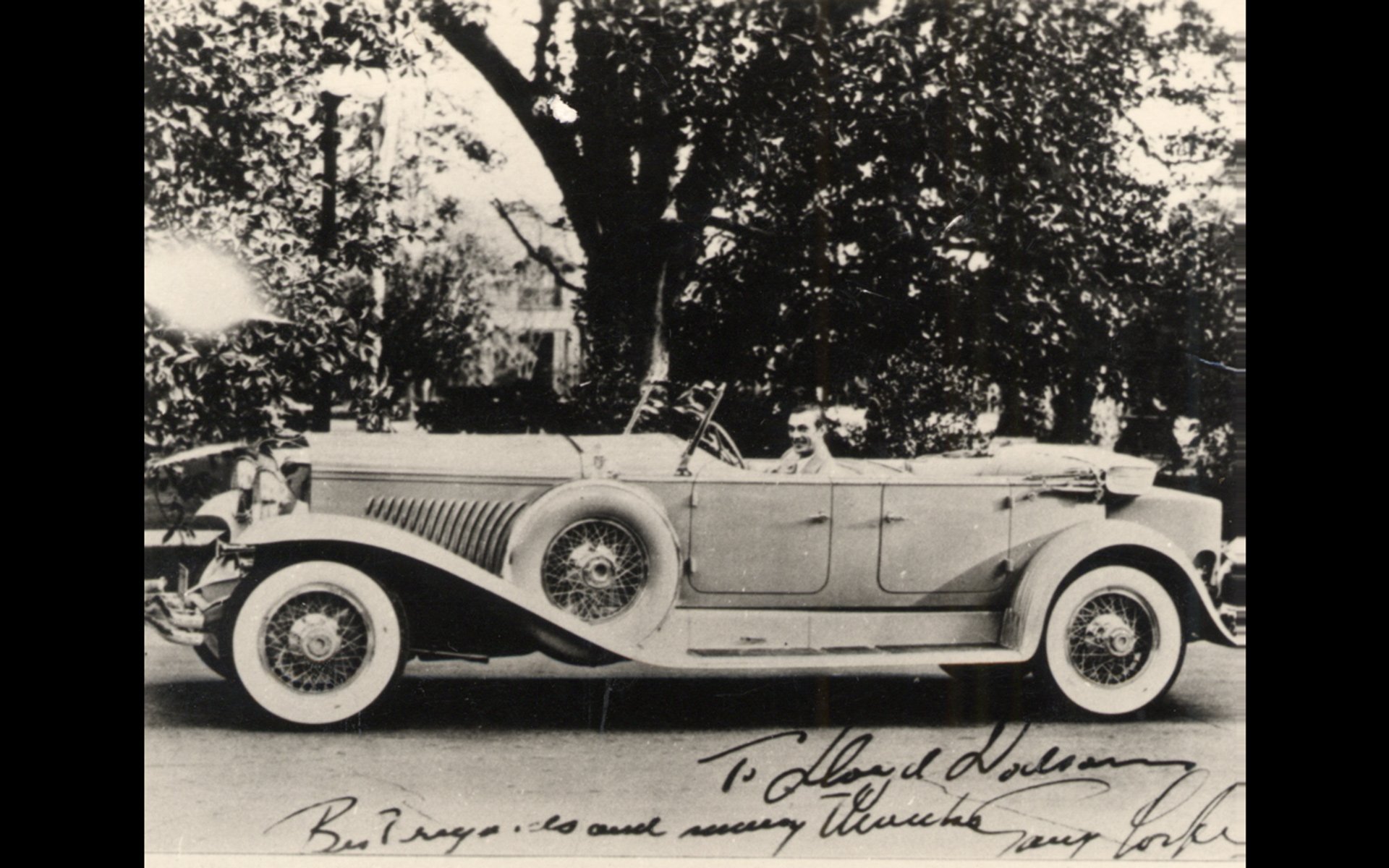 Actor Gary Cooper with Vogue Tyre whitewalls on his car.